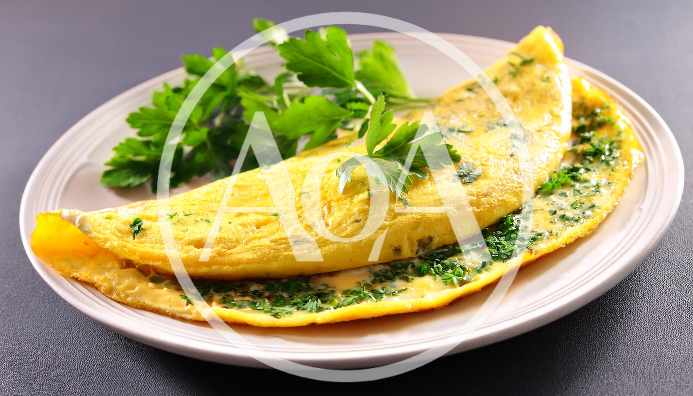 Fresh Herb Omelet Served On A White Plate