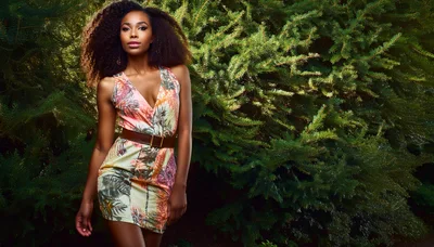Fashionable Woman Posing In Tropical Print Dress