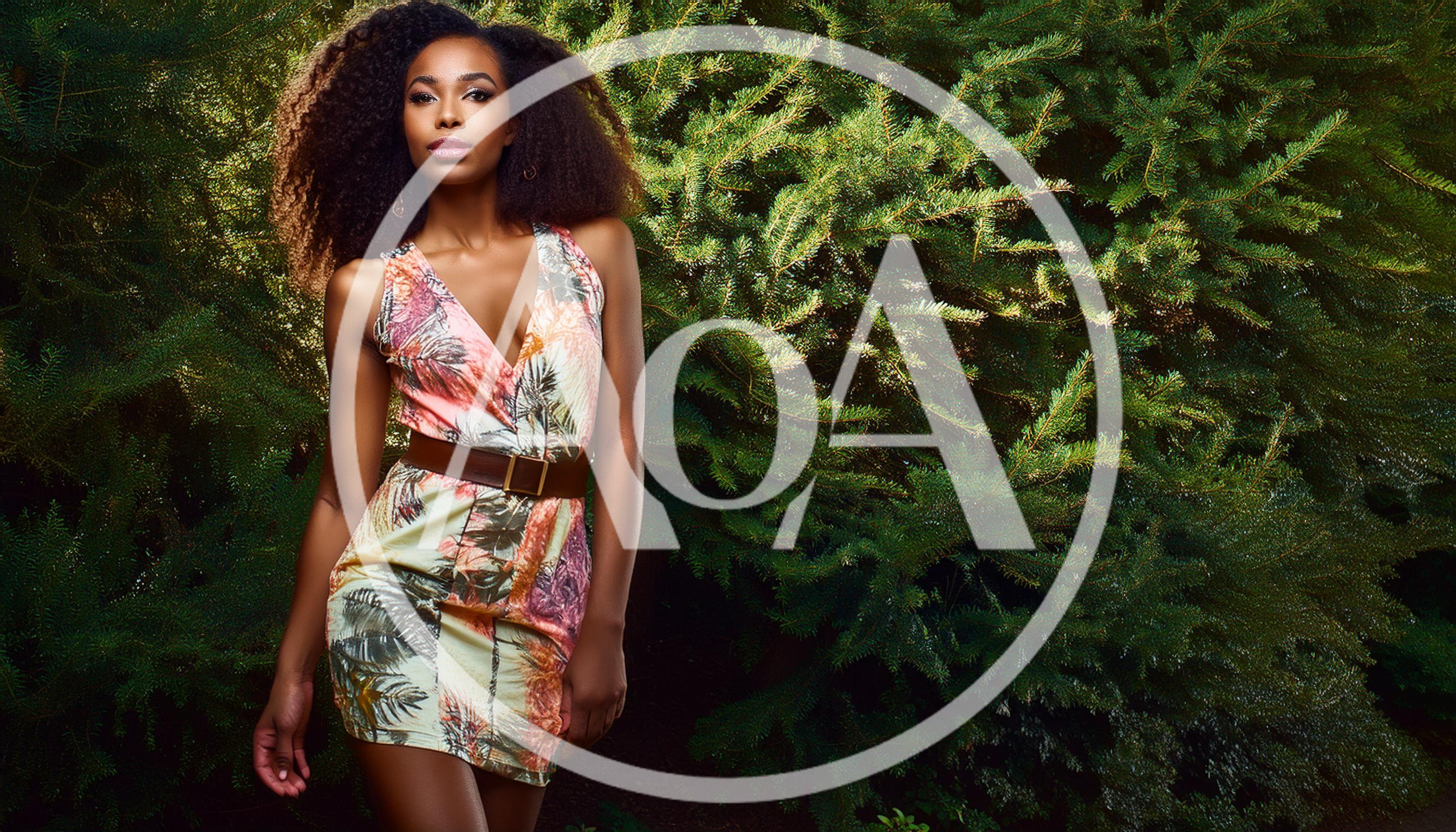 Fashionable Woman Posing In Tropical Print Dress