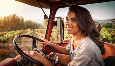 Smiling Woman Driving A Tractor Through A Vineyard