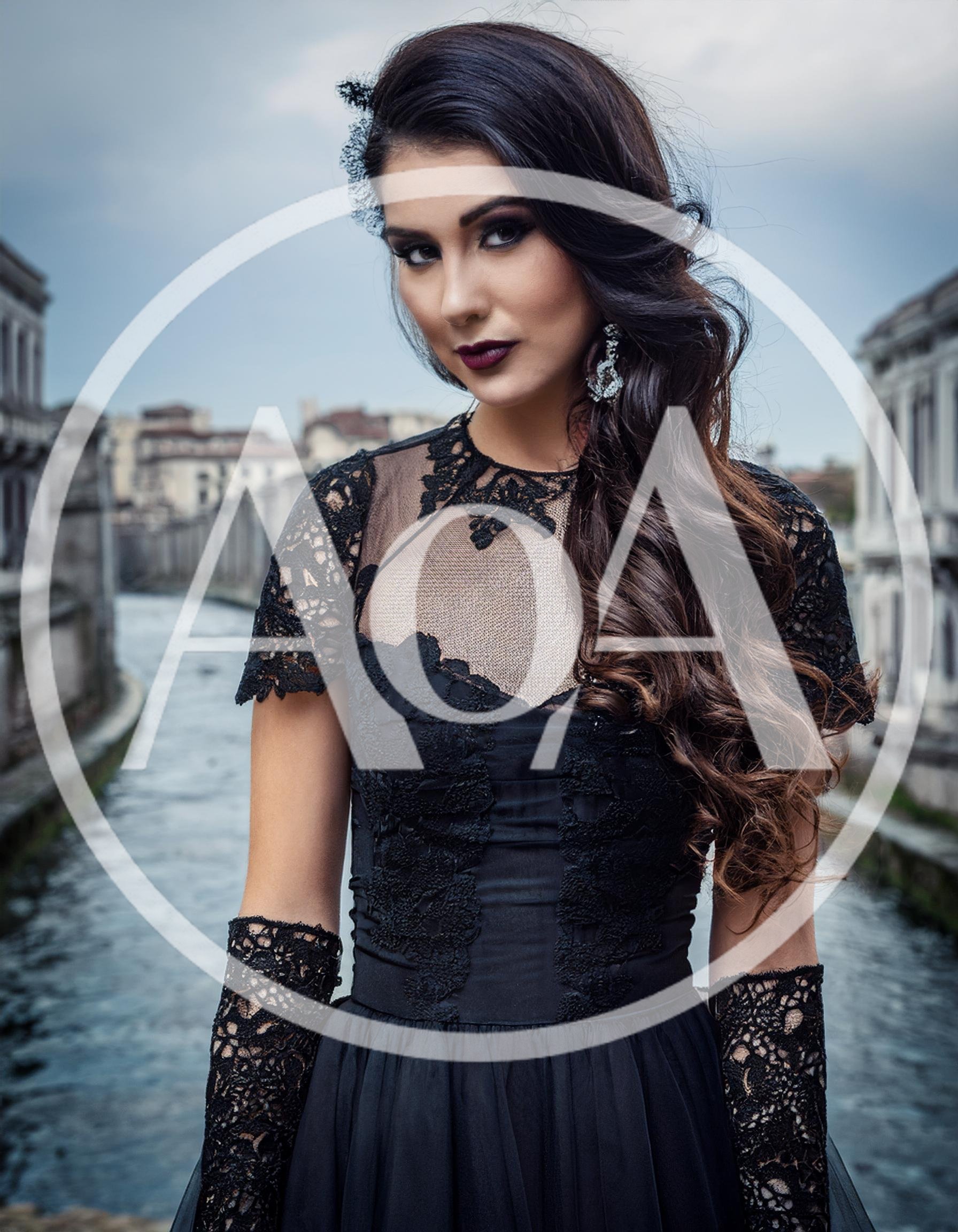 Elegant Woman In Black Lace Dress Standing On Bridge