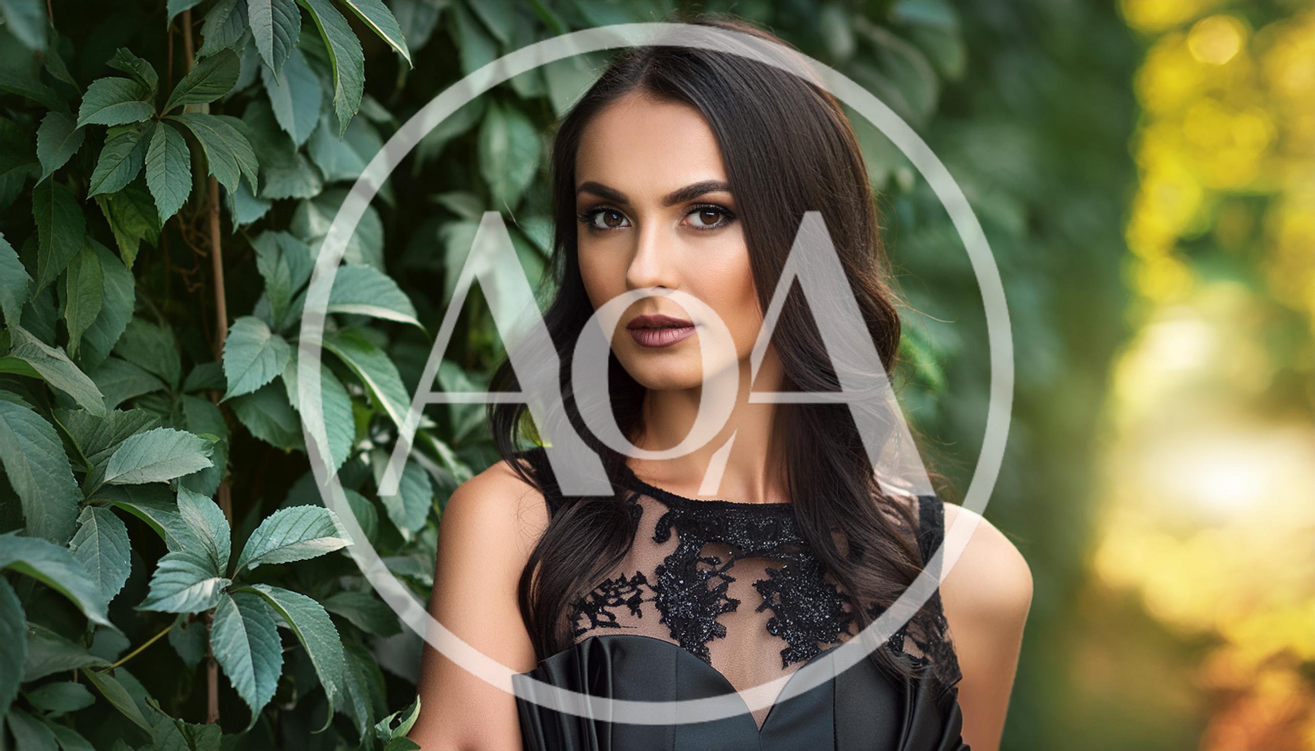 Portrait Of A Beautiful Woman In A Black Dress