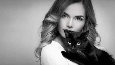 Beautiful Woman Holding A Black Cat