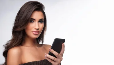 Beautiful Woman Holding A Smartphone