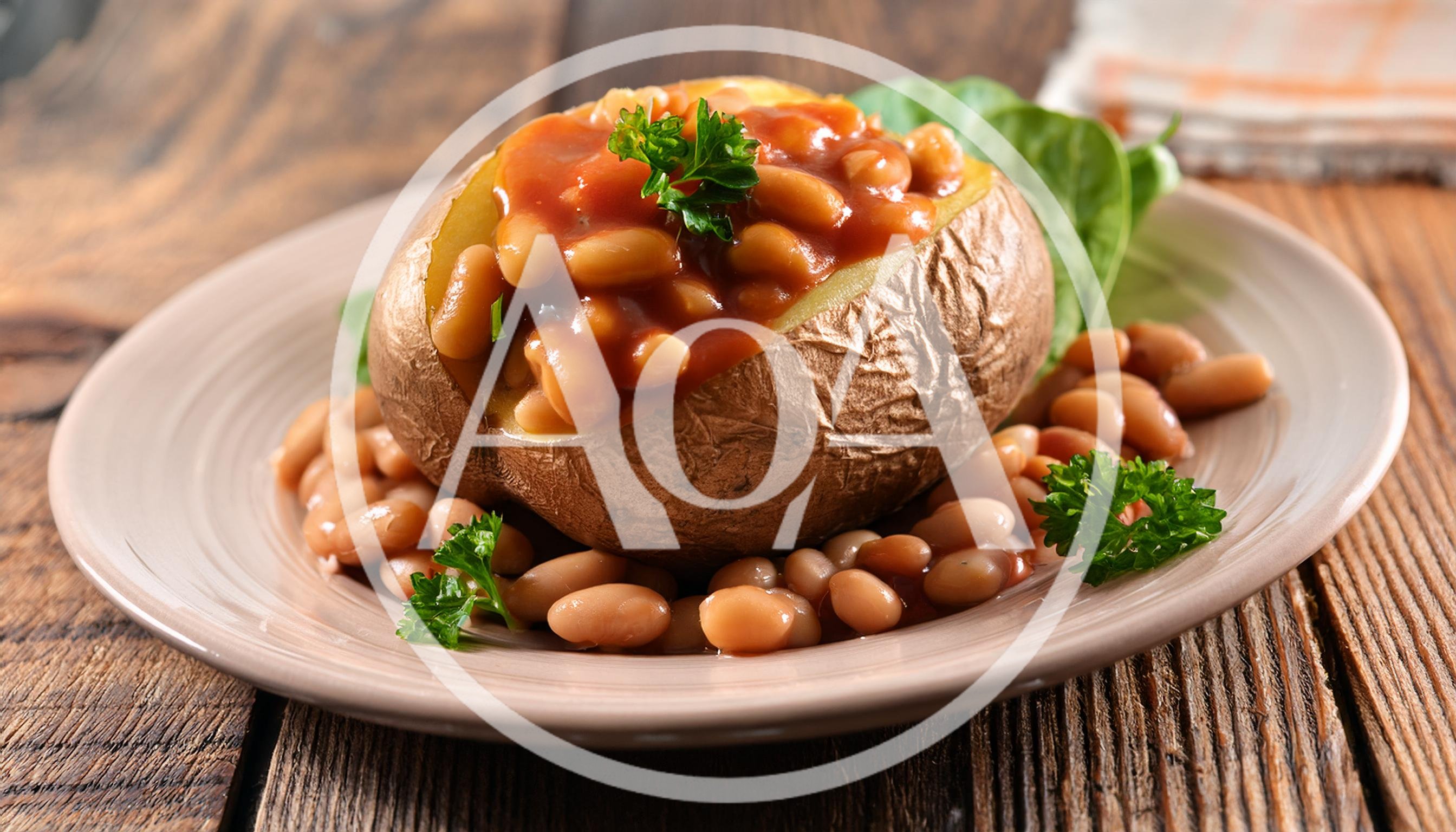 Baked Potato Topped With Baked Beans On A Plate
