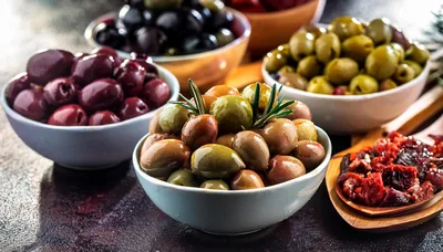 Assorted Bowls Of Marinated Olives And Sun Dried Tomatoes