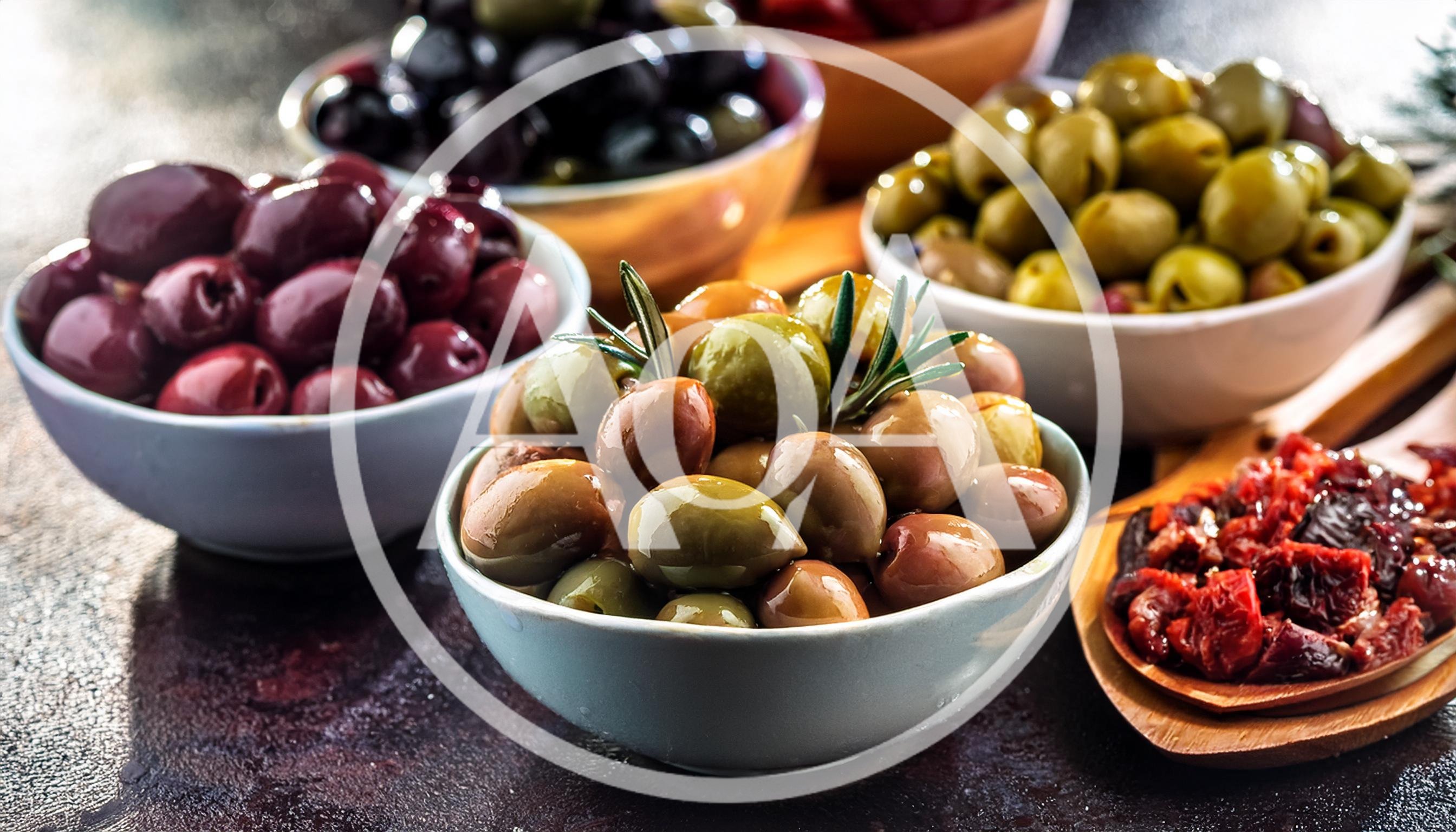 Assorted Bowls Of Marinated Olives And Sun Dried Tomatoes