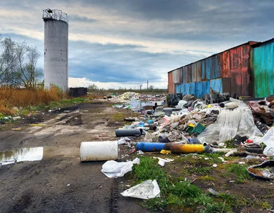 Industrial Waste Dump Site With Metal Silo And Shed