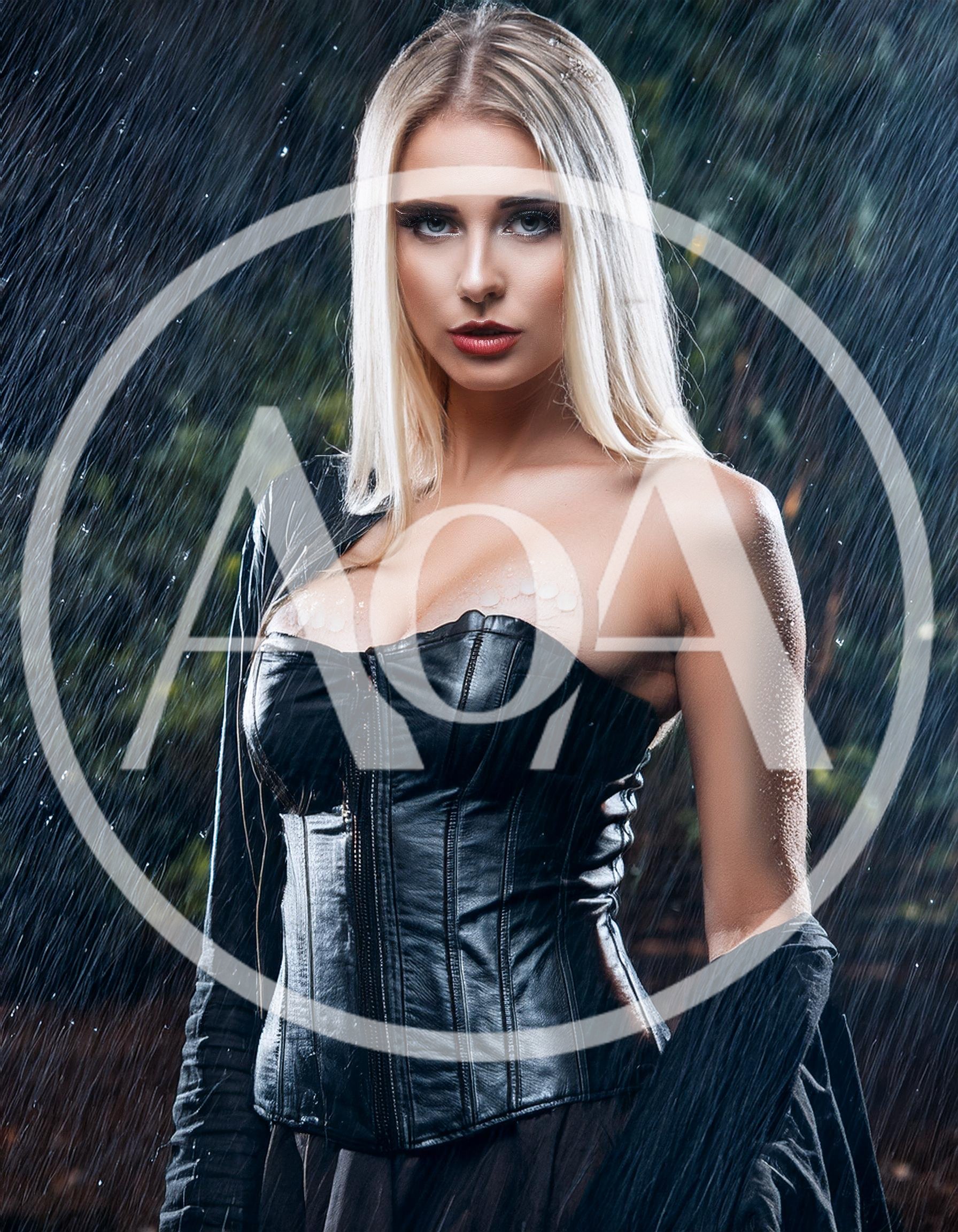 Blonde Woman In Leather Corset Standing In Rain