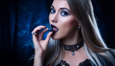 Gothic Woman Eating A Fresh Blueberry