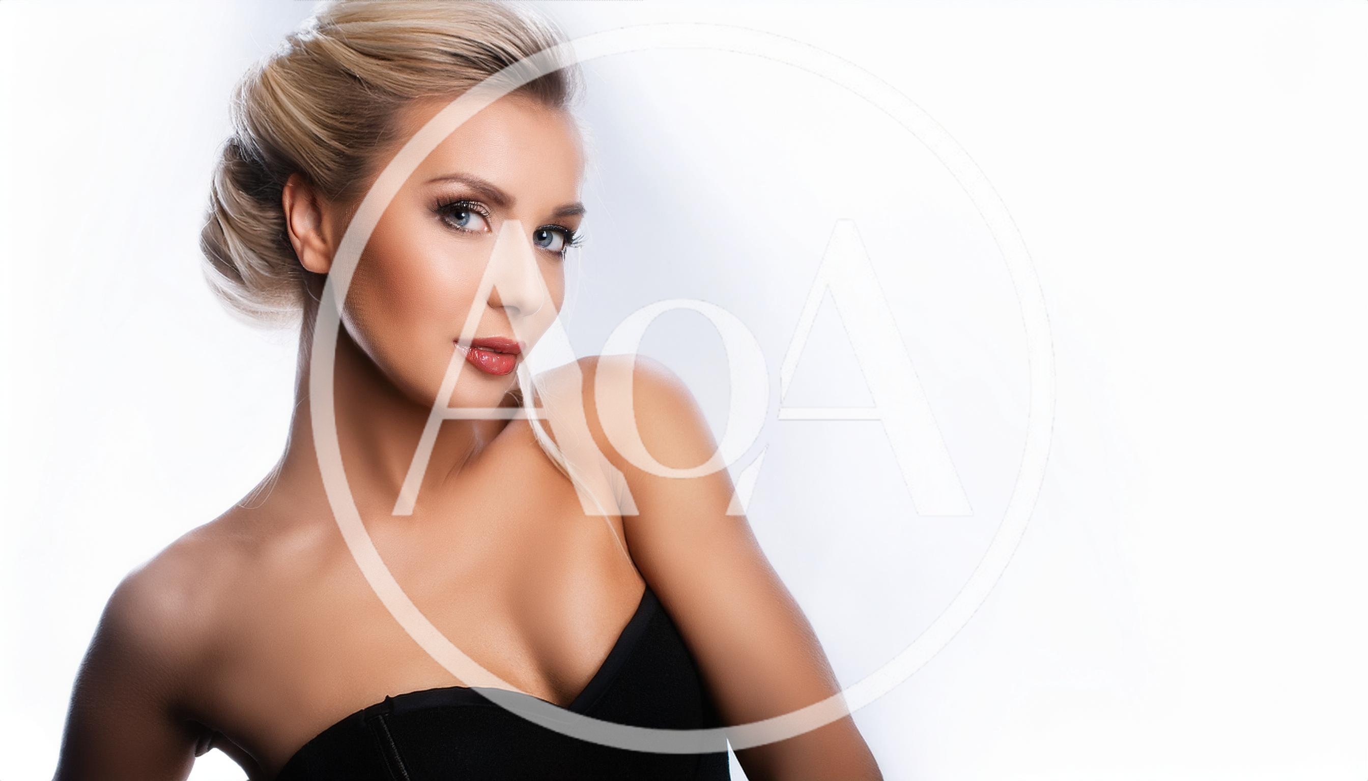 Portrait Of A Beautiful Blonde Woman In A Corset