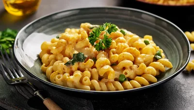 Bowl Of Creamy Macaroni And Cheese With Parsley