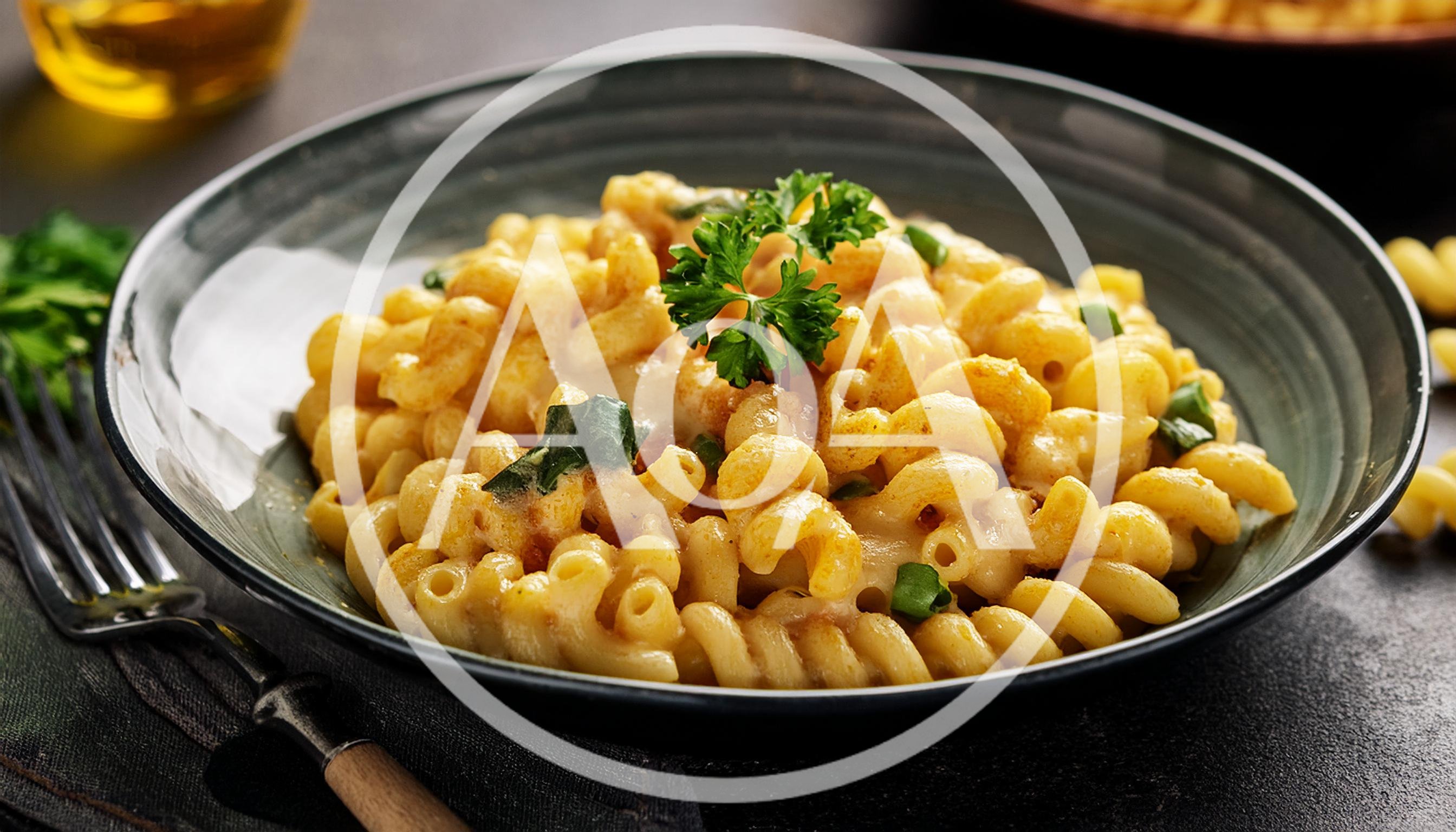 Bowl Of Creamy Macaroni And Cheese With Parsley