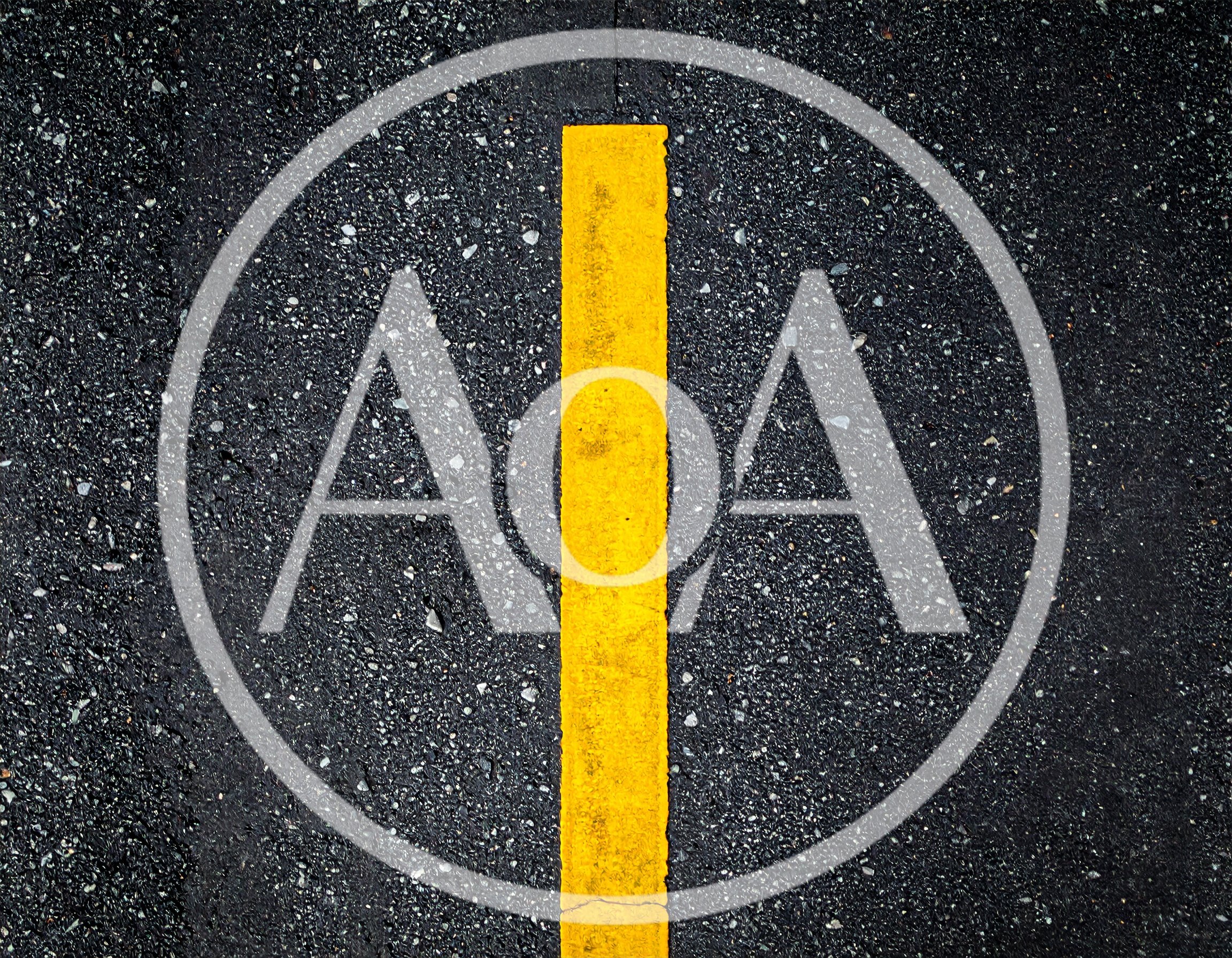 Yellow Painted Line On Wet Asphalt Road Surface