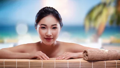 Young Asian Woman Relaxing At A Tropical Spa