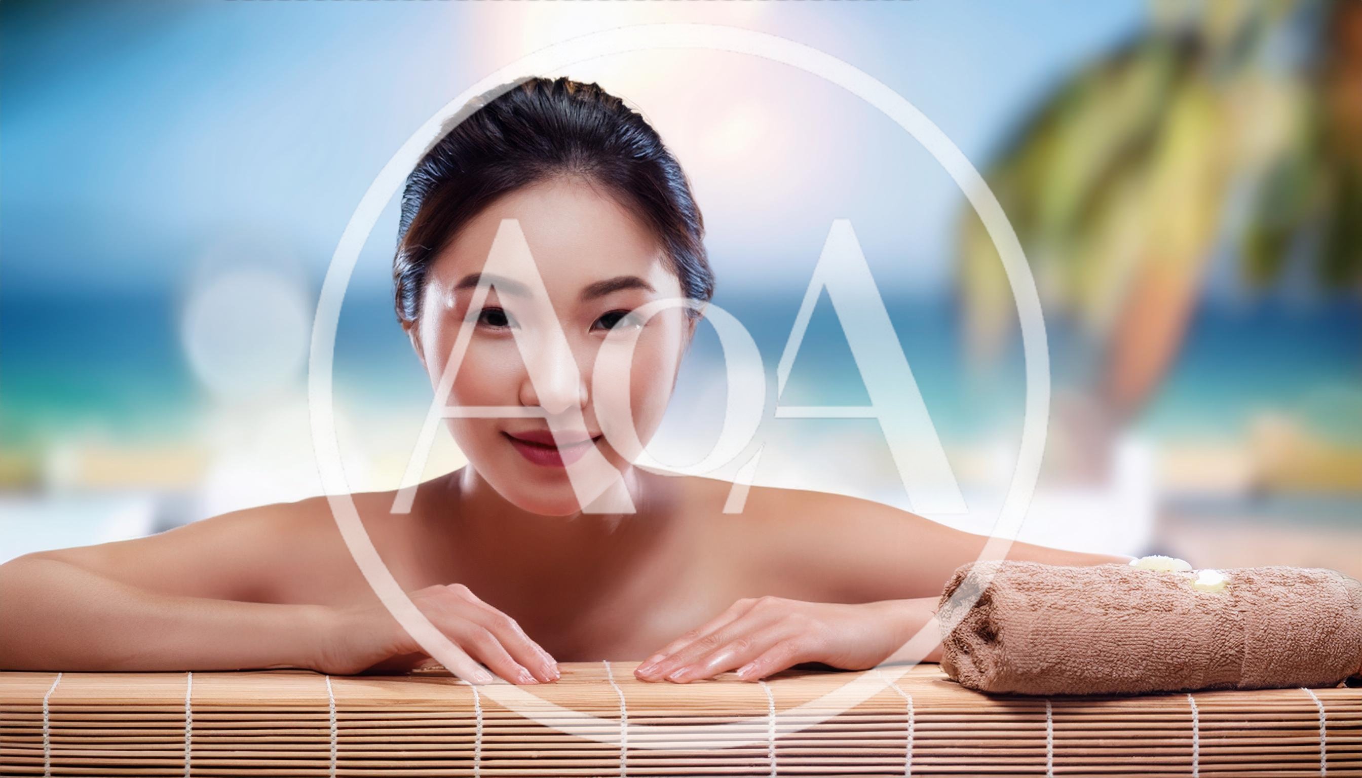 Young Asian Woman Relaxing At A Tropical Spa