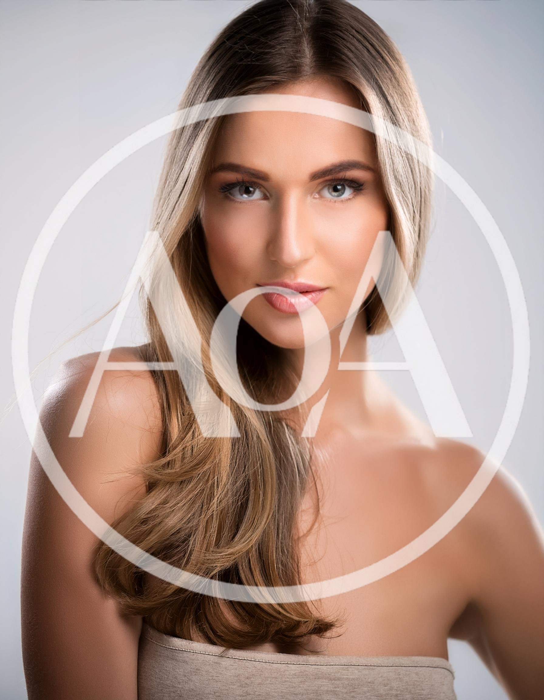 Portrait Of A Beautiful Young Woman With Blonde Hair