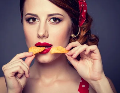 Pin-Up Woman Eating Potato Chips