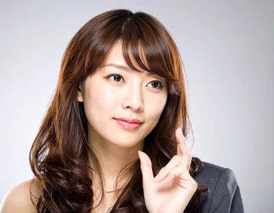 Professional Asian Woman Gesturing With Her Fingers