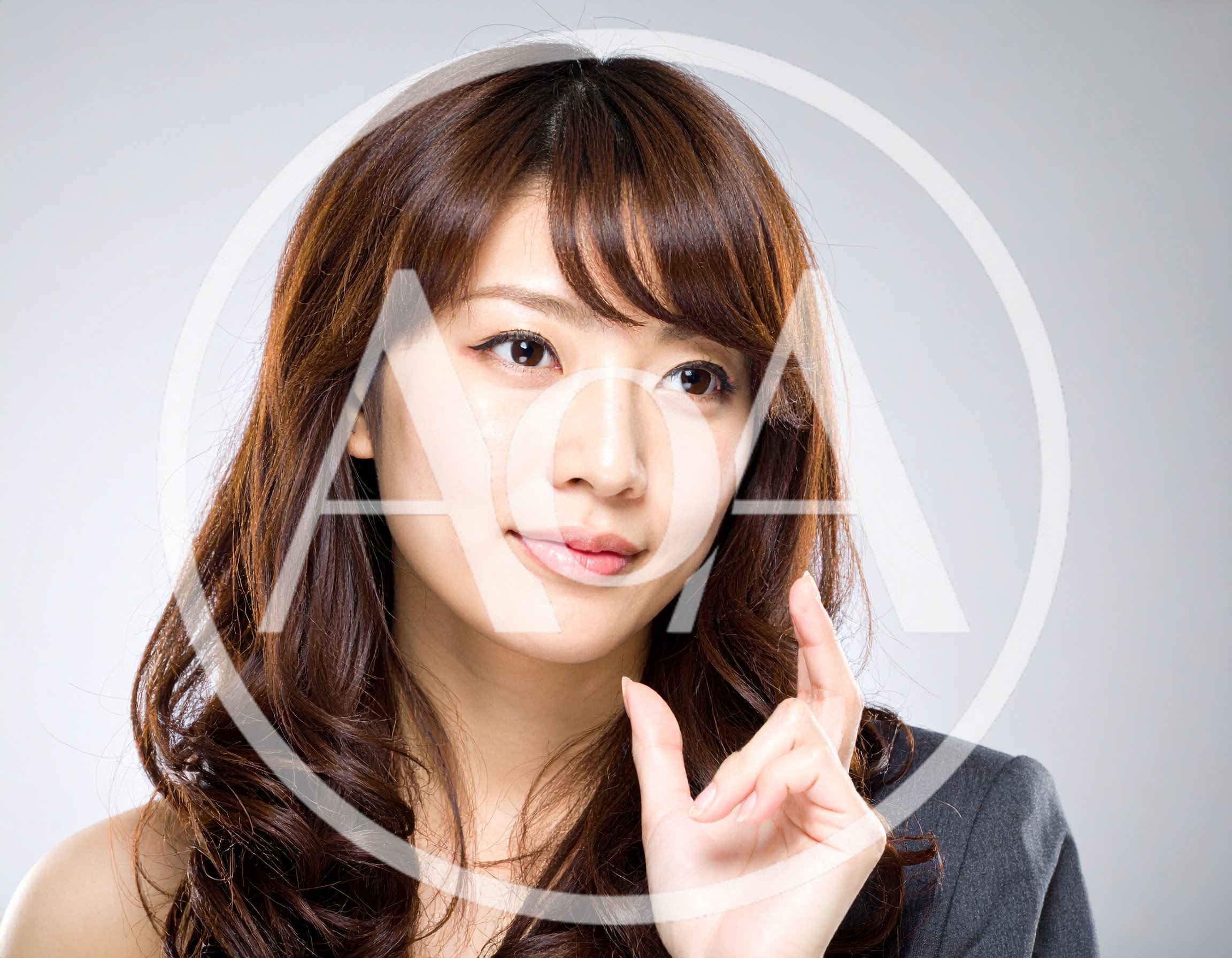 Professional Asian Woman Gesturing With Her Fingers