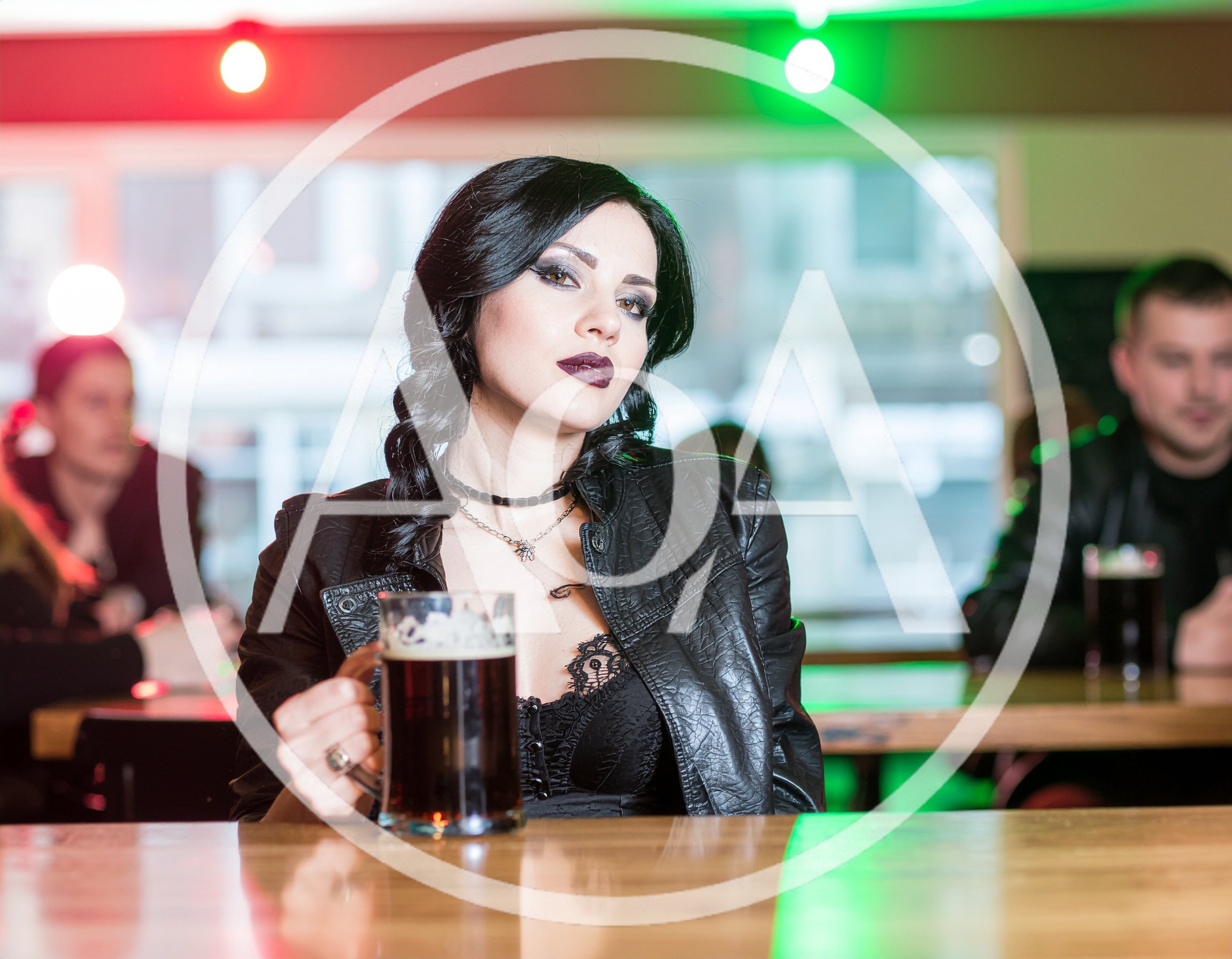 Gothic Woman Drinking Dark Beer In A Pub