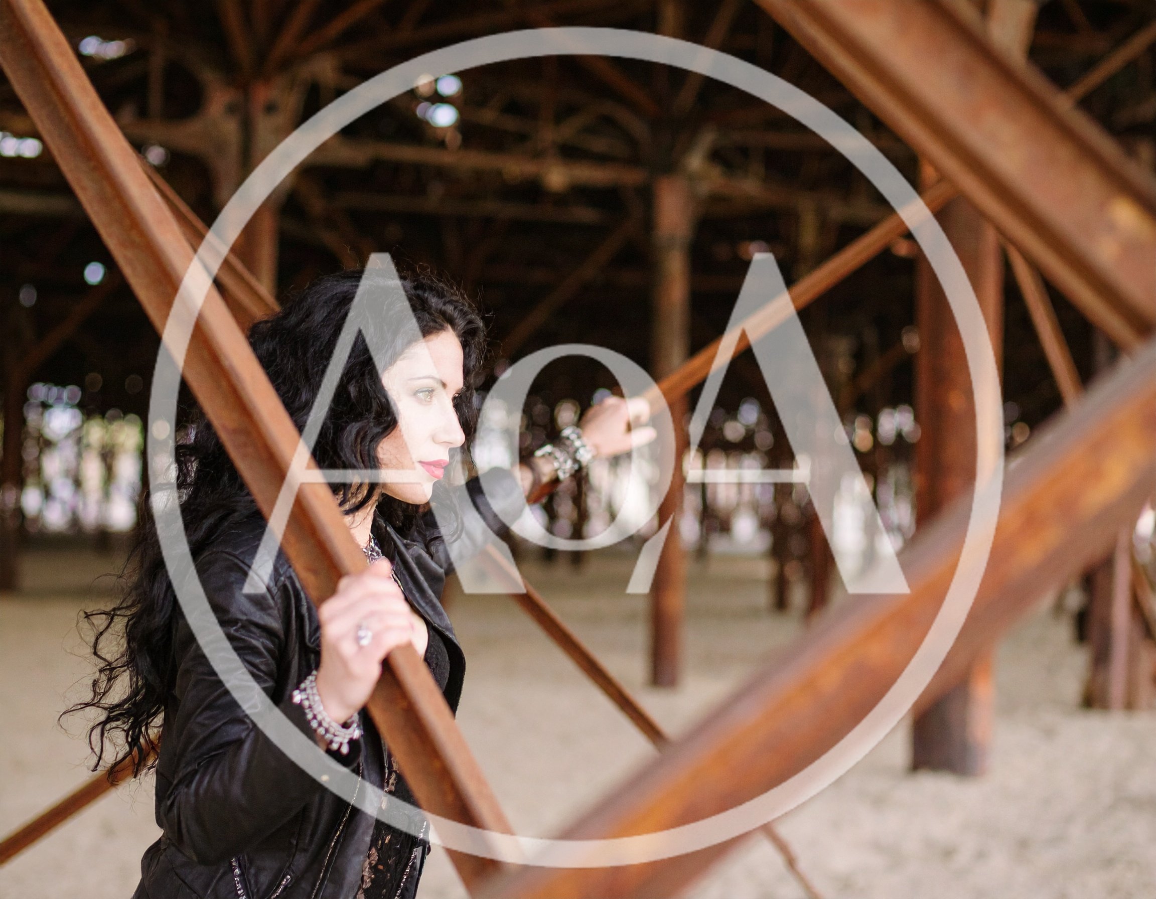 Woman With Dark Hair Posing Under A Pier