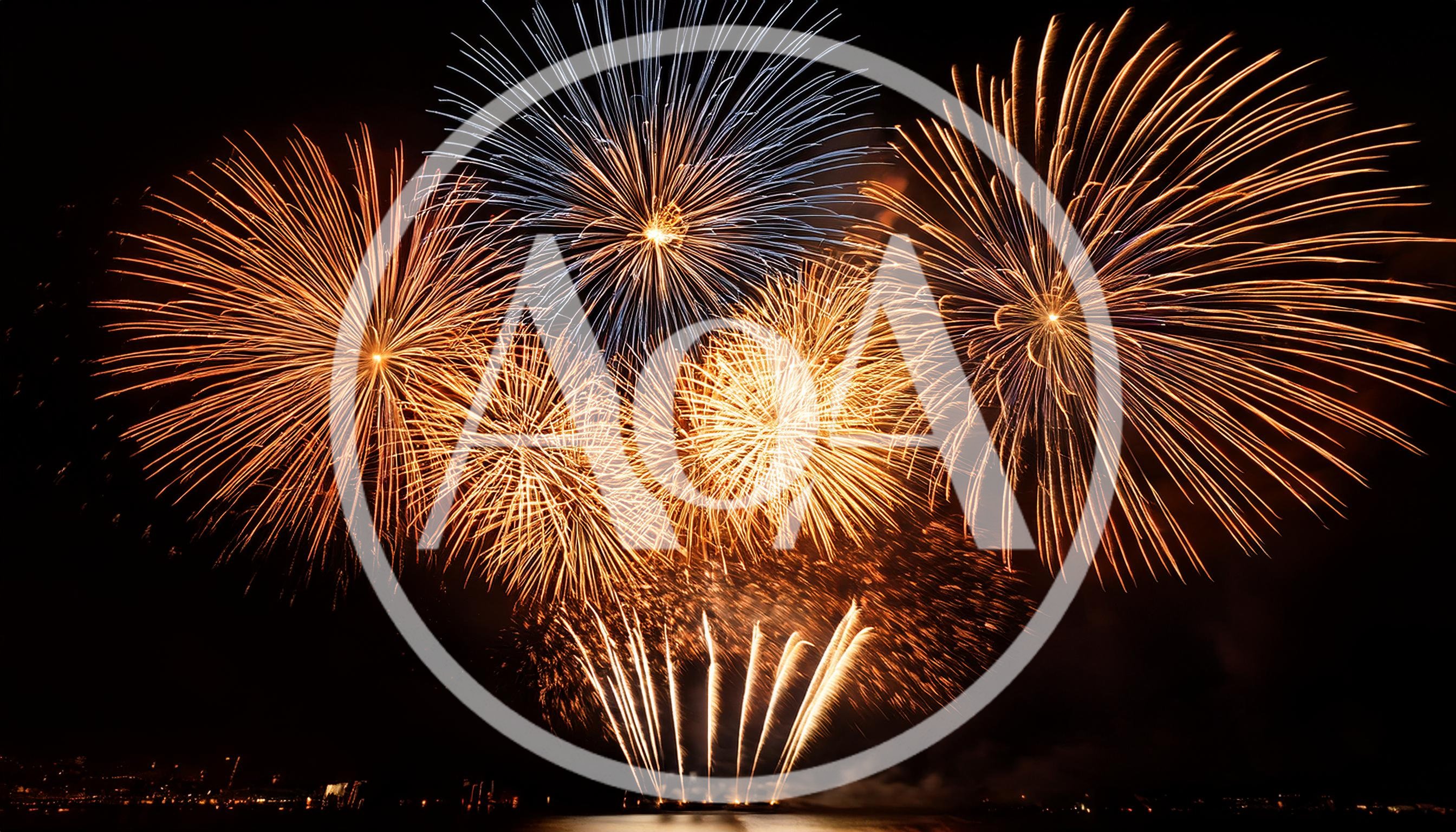 Vibrant Golden And Blue Fireworks Display Over Water