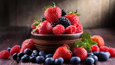 Fresh Mixed Berries In A Rustic Ceramic Bowl