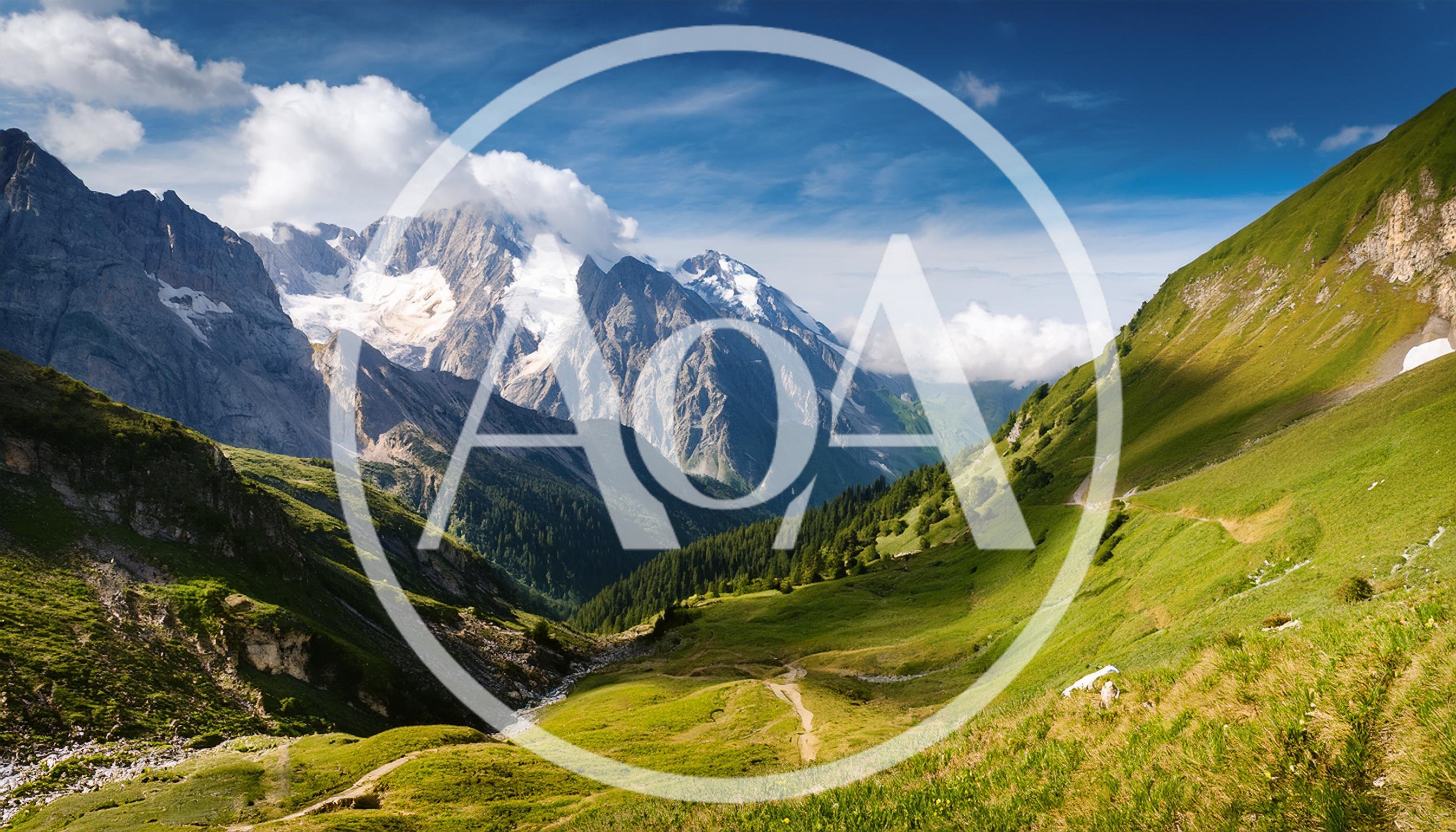 Scenic Alpine Valley With Snow Capped Mountain Peaks