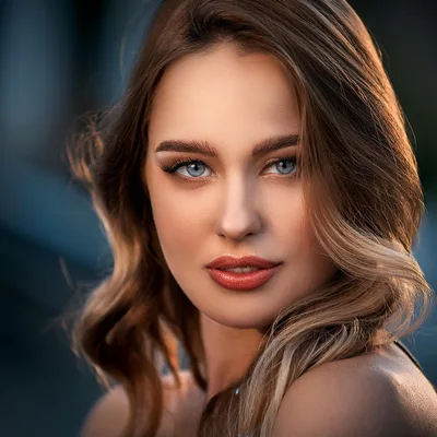 Portrait Of A Beautiful Young Woman With Blue Eyes