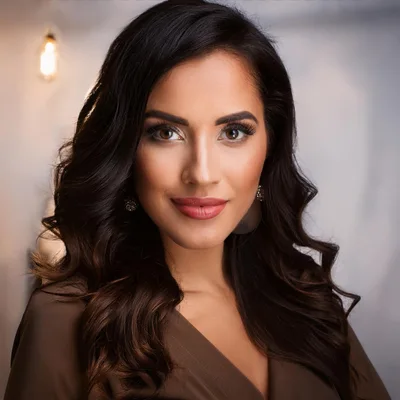 Portrait Of A Beautiful Woman With Wavy Dark Hair