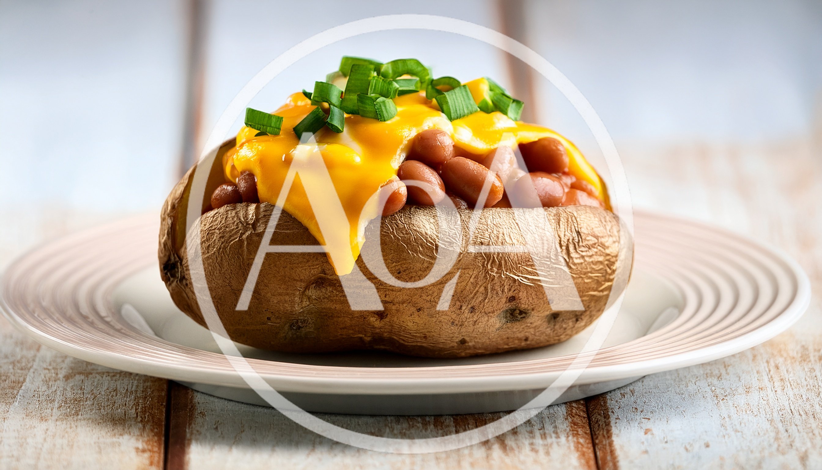 Baked Potato Topped With Beans And Melted Cheese