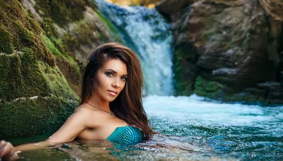 Beautiful Woman Posing In A Natural Waterfall Pool