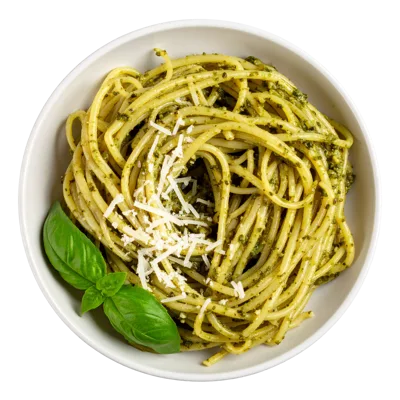 Spaghetti Pasta With Pesto Sauce In A White Bowl