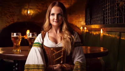 Young Woman In Traditional Bavarian Dirndl At Tavern