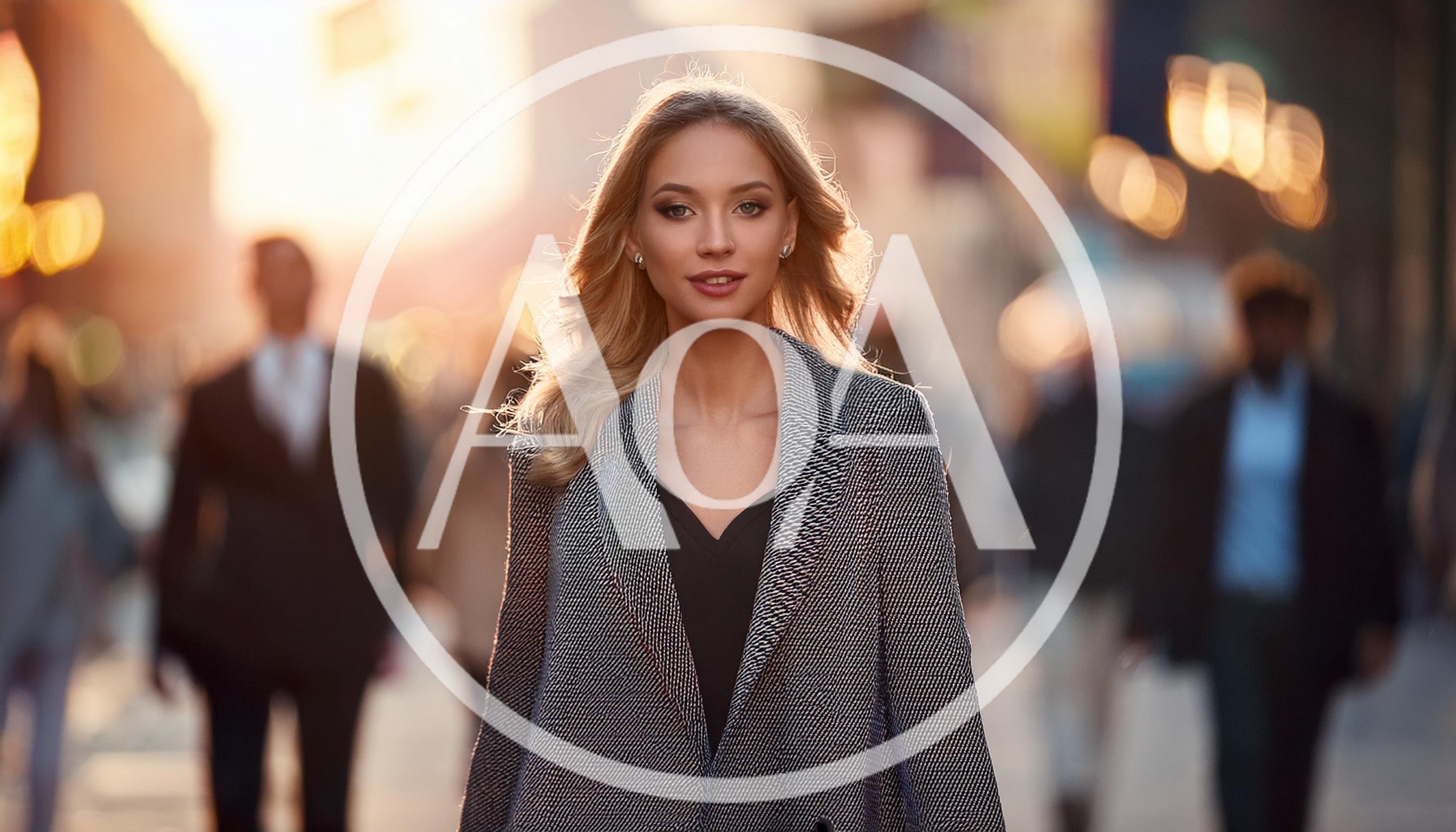 Confident Businesswoman Walking Through A Busy City Street