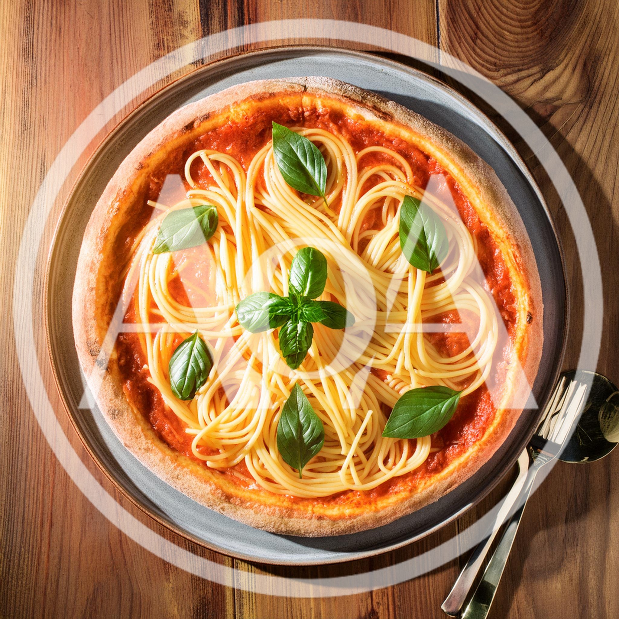 Spaghetti Topped Pizza With Fresh Basil Leaves