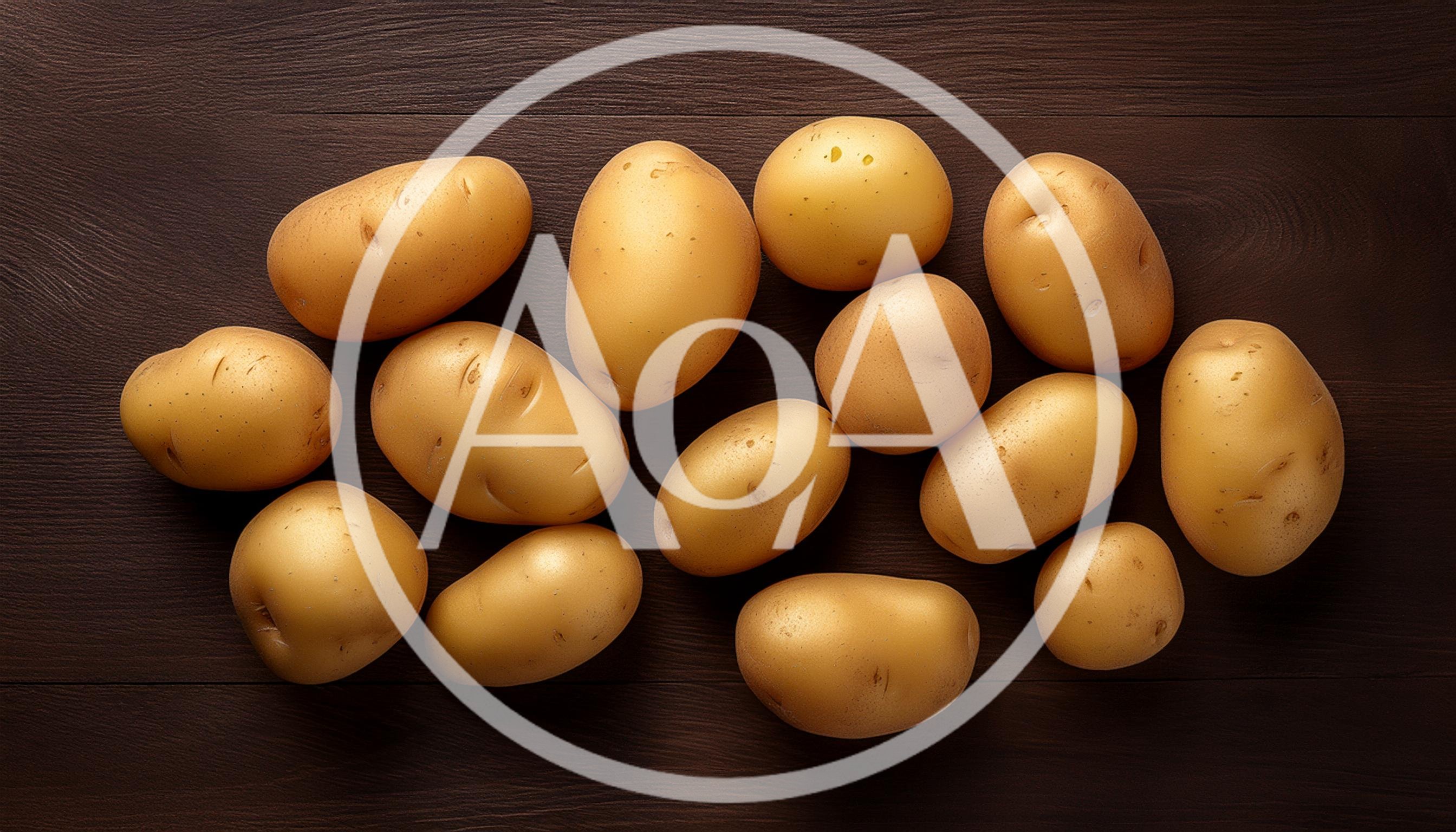 Fresh Raw Potatoes Arranged On Dark Wooden Table