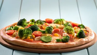 Vegetable Pizza With Broccoli And Tomatoes On Wooden Board
