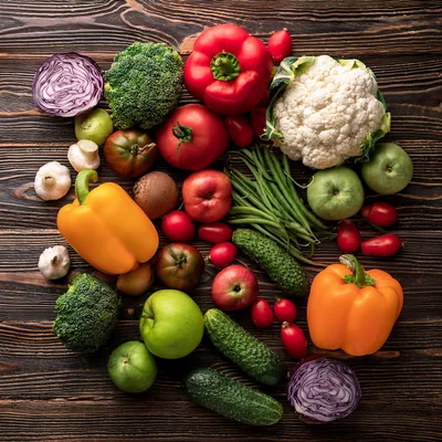 Fresh Assorted Vegetables and Fruits on Wooden Table