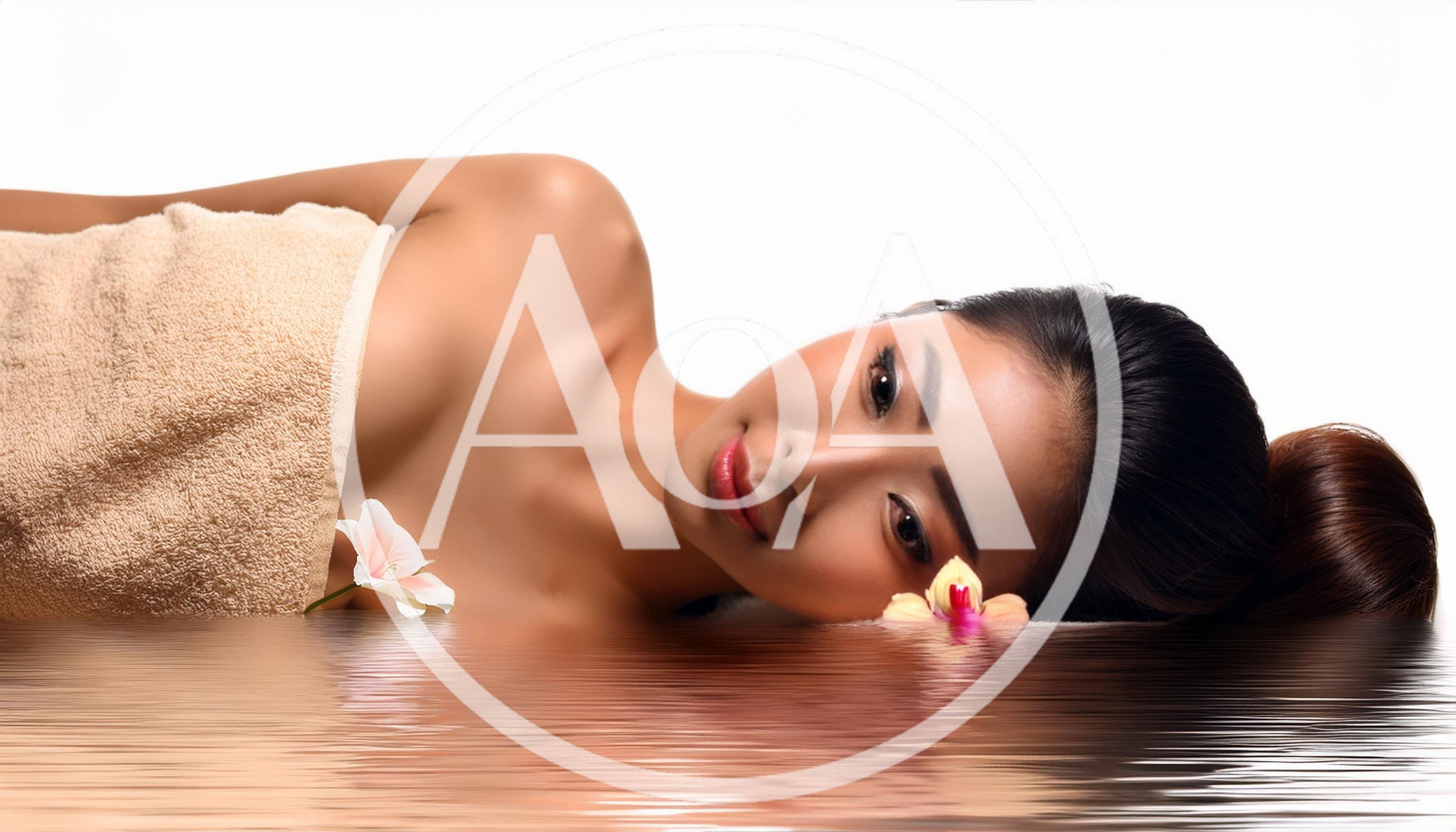 Beautiful Asian Woman Relaxing In A Spa Setting