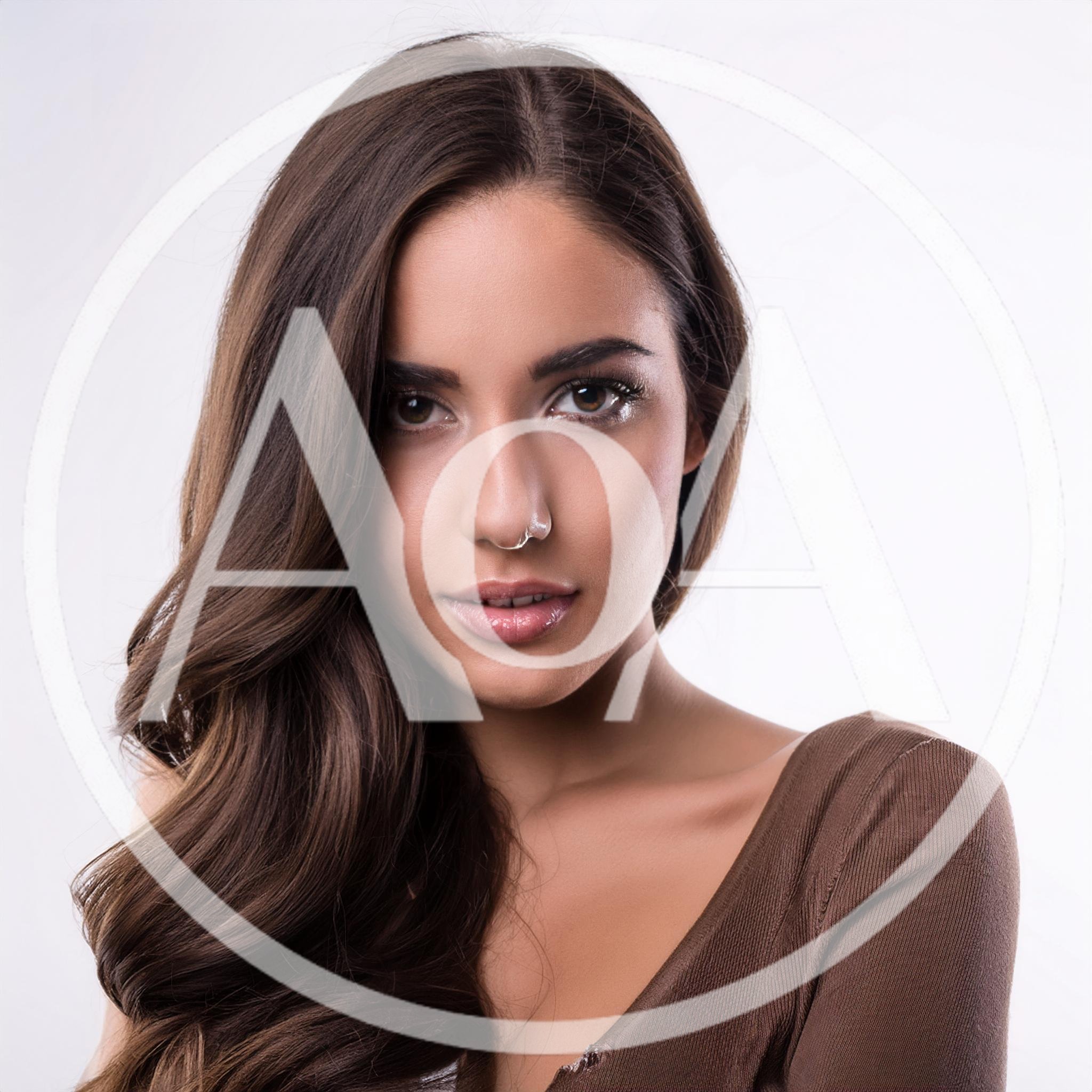 Portrait Of A Beautiful Young Woman With Long Hair