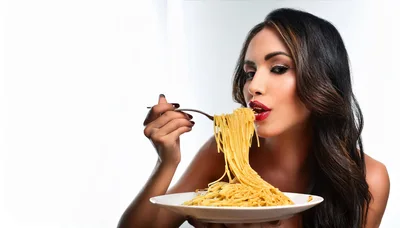 Beautiful Woman Eating Spaghetti From A Plate