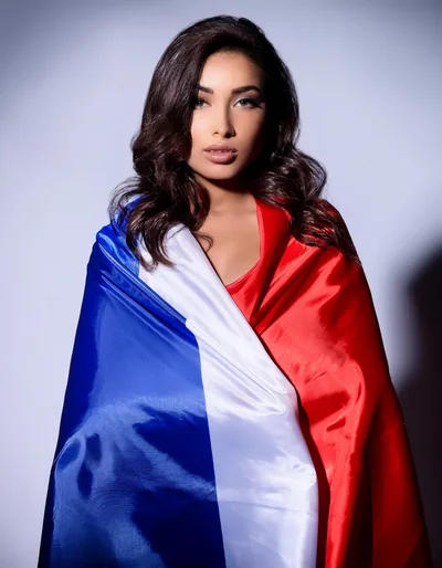 Young Woman Wrapped In A French Flag