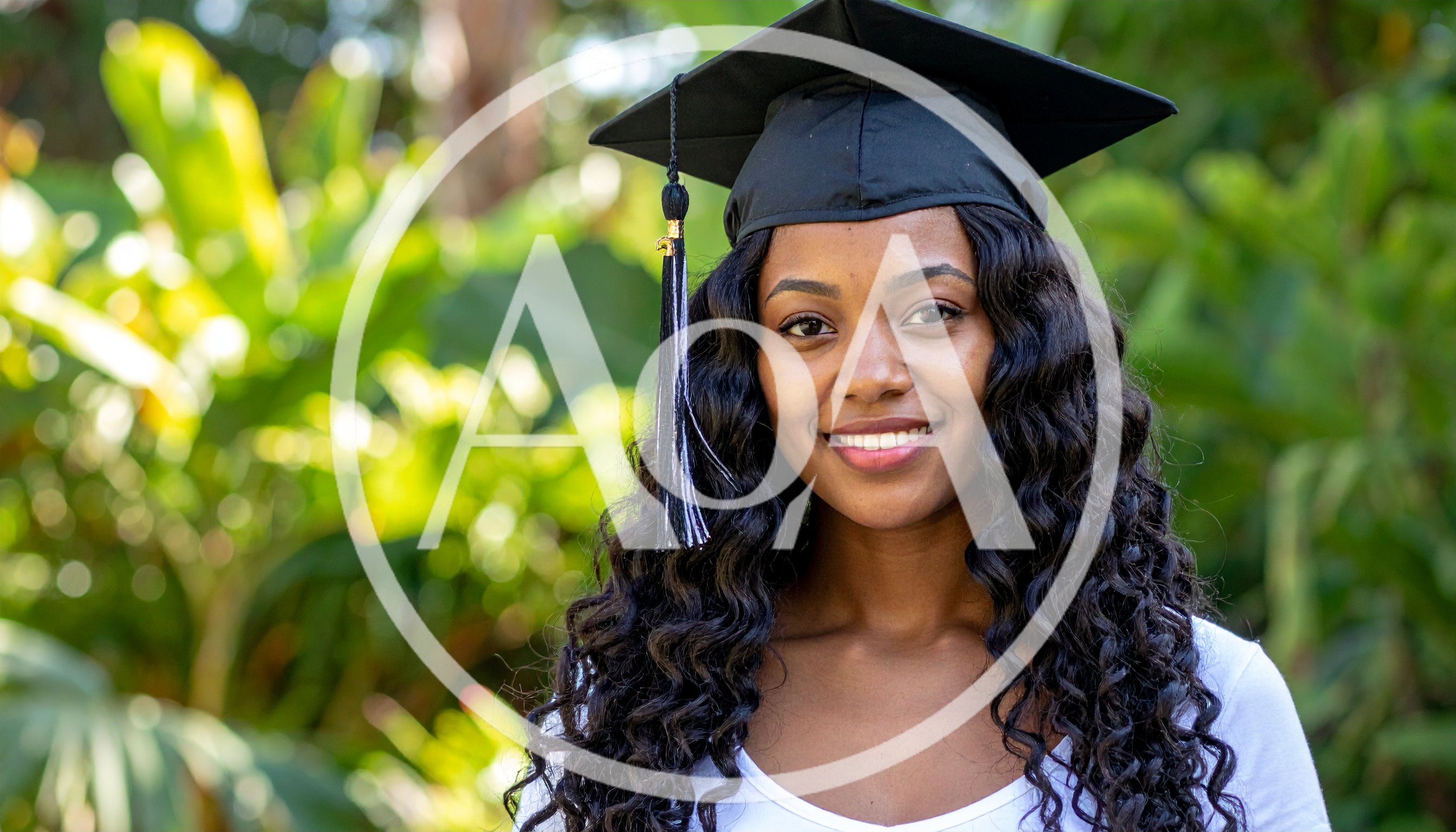 Young Woman Wearing Graduation Cap Outdoors