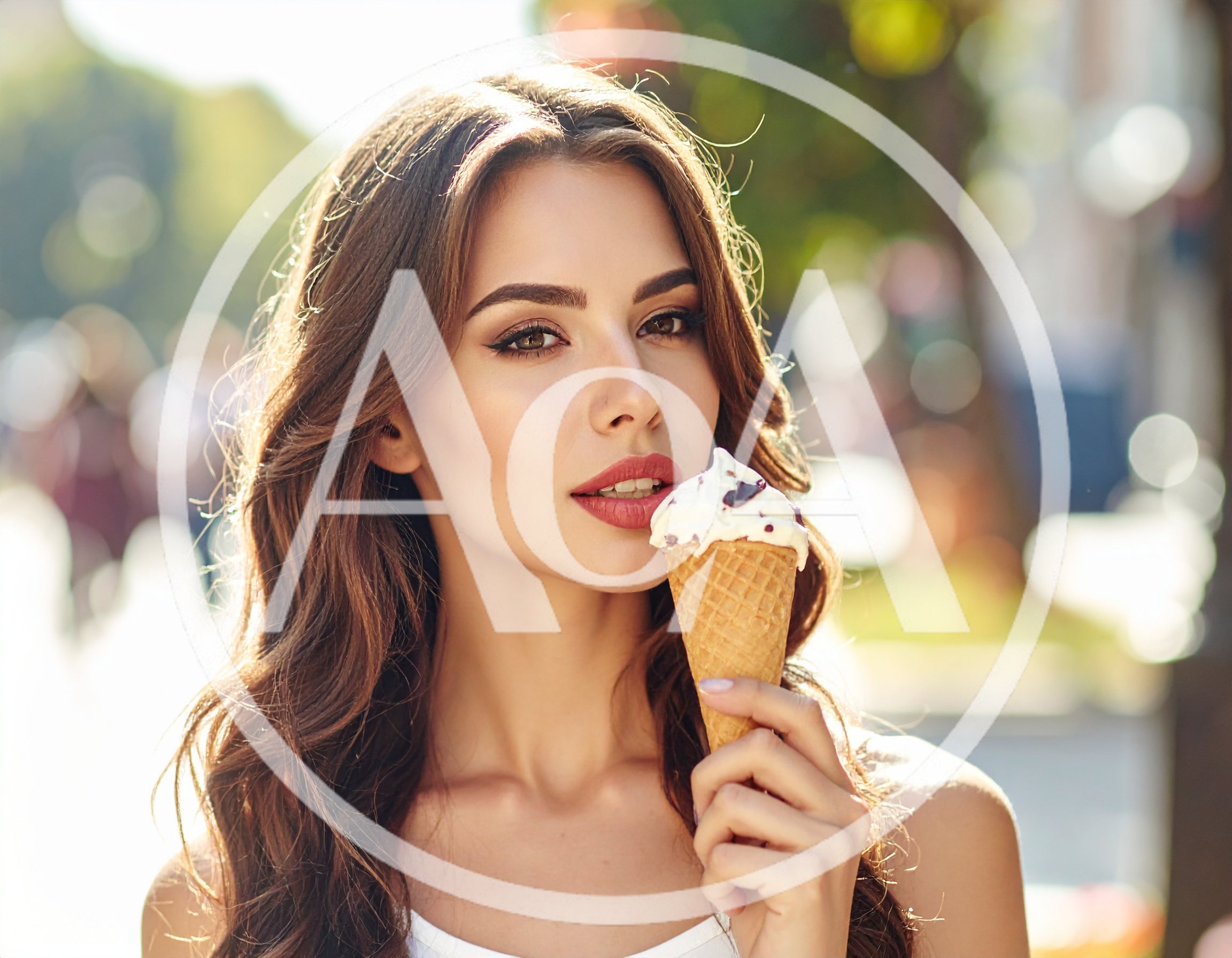 Beautiful Young Woman Eating Ice Cream Outdoors