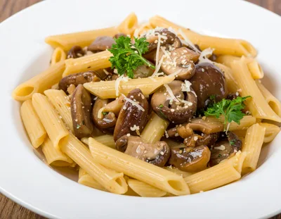 Penne Pasta With Sautéed Mushrooms And Parmesan Cheese