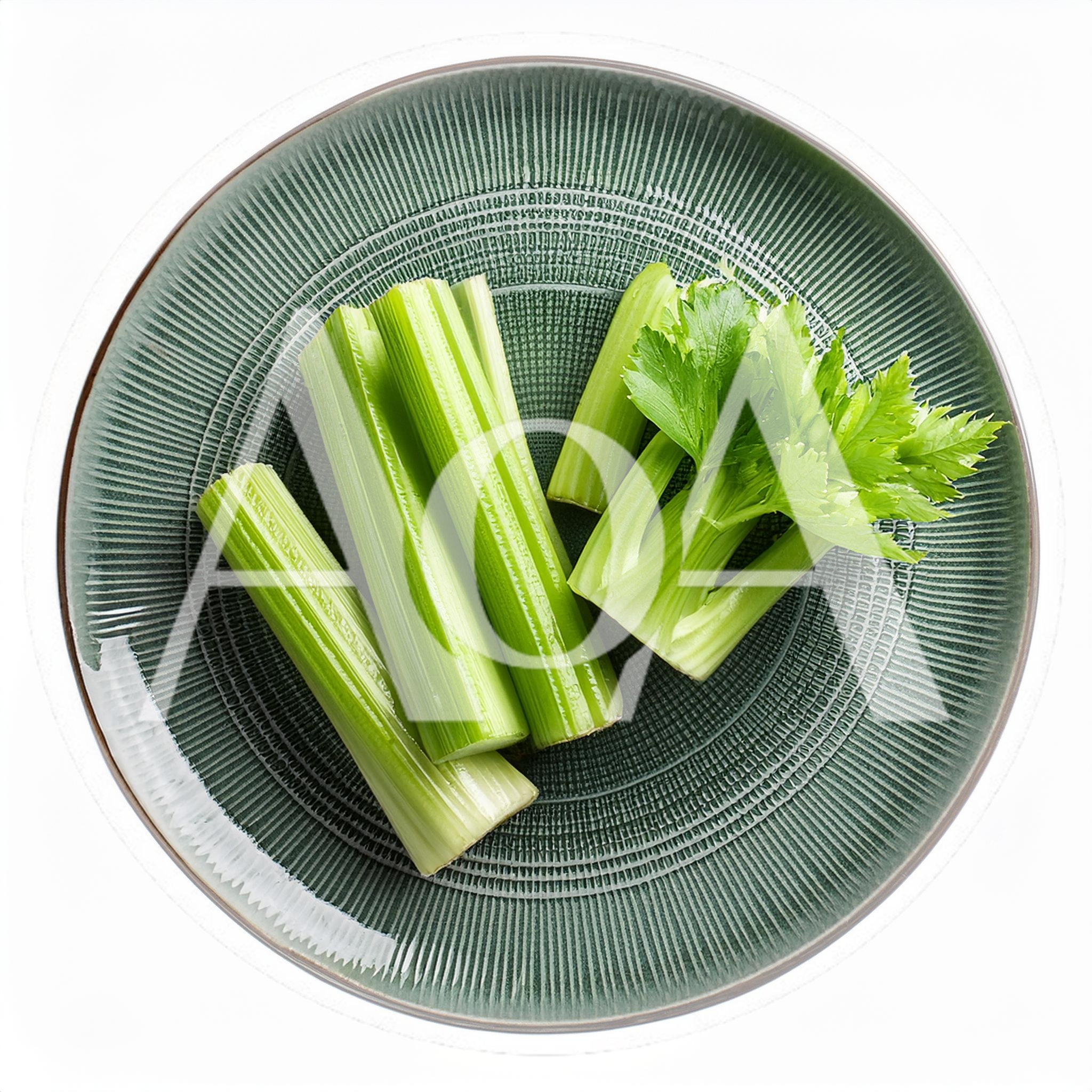 Fresh Celery Stalks Arranged On A Textured Green Plate