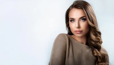 Portrait Of A Beautiful Young Woman With Wavy Hair