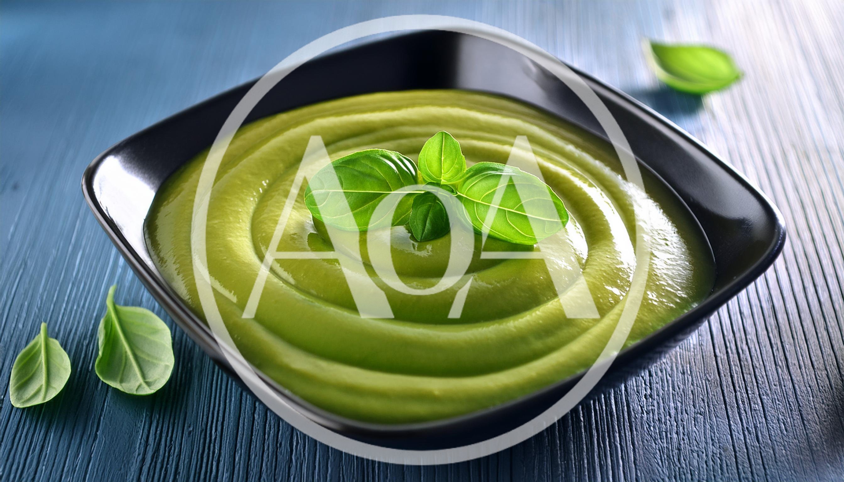 Green Vegetable Soup In A Black Bowl